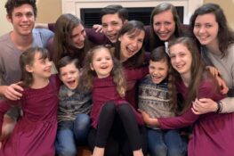 single mom and 10 kids group hug
