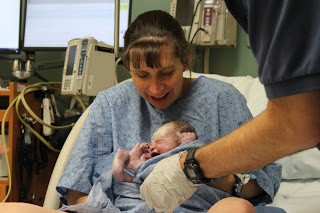 new mom happy after a fast labor and delivery