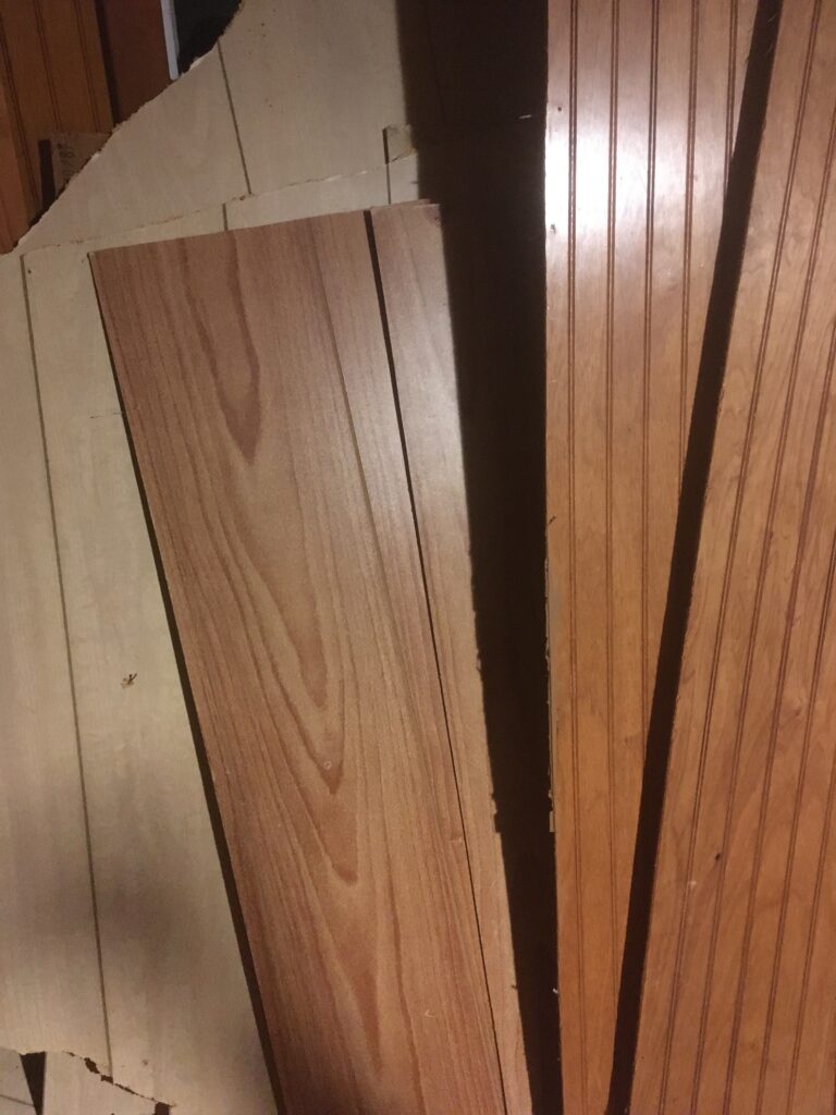three kinds of wood paneling that came out of a closet