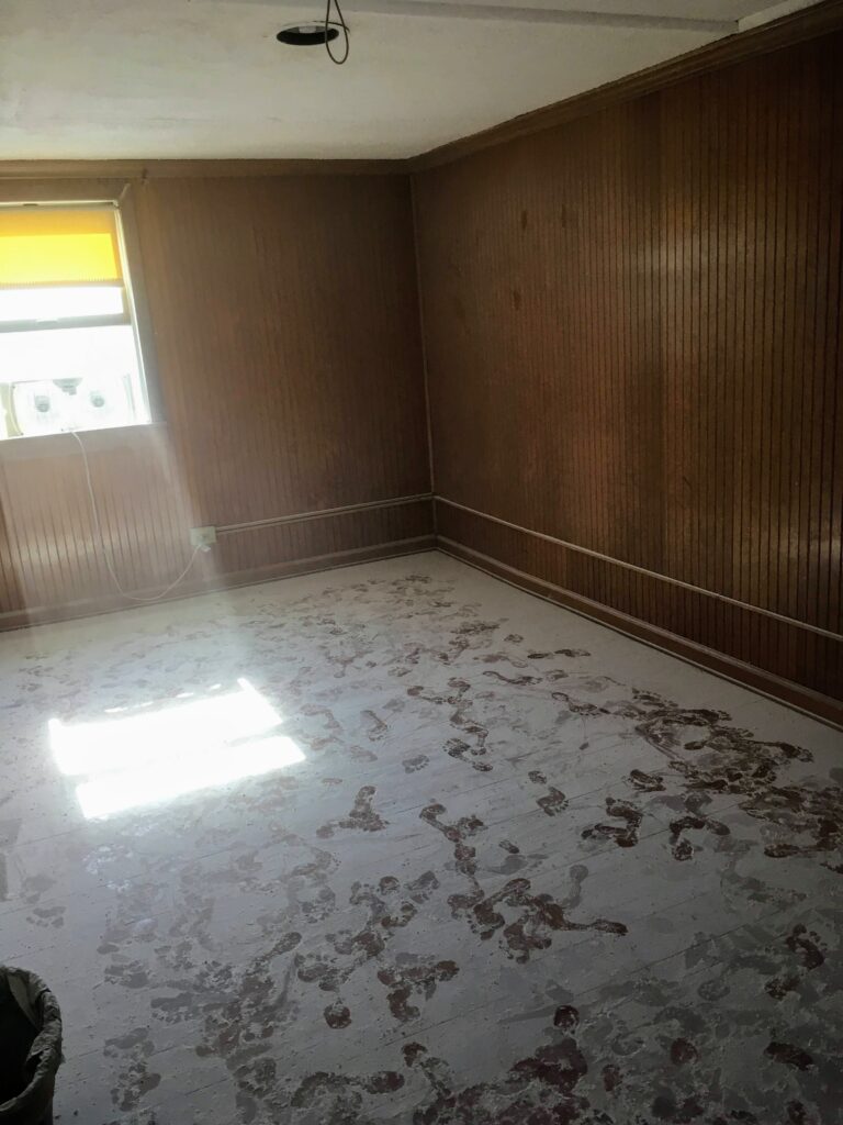 sanding textured popcorn ceiling in a teen bedroom reno