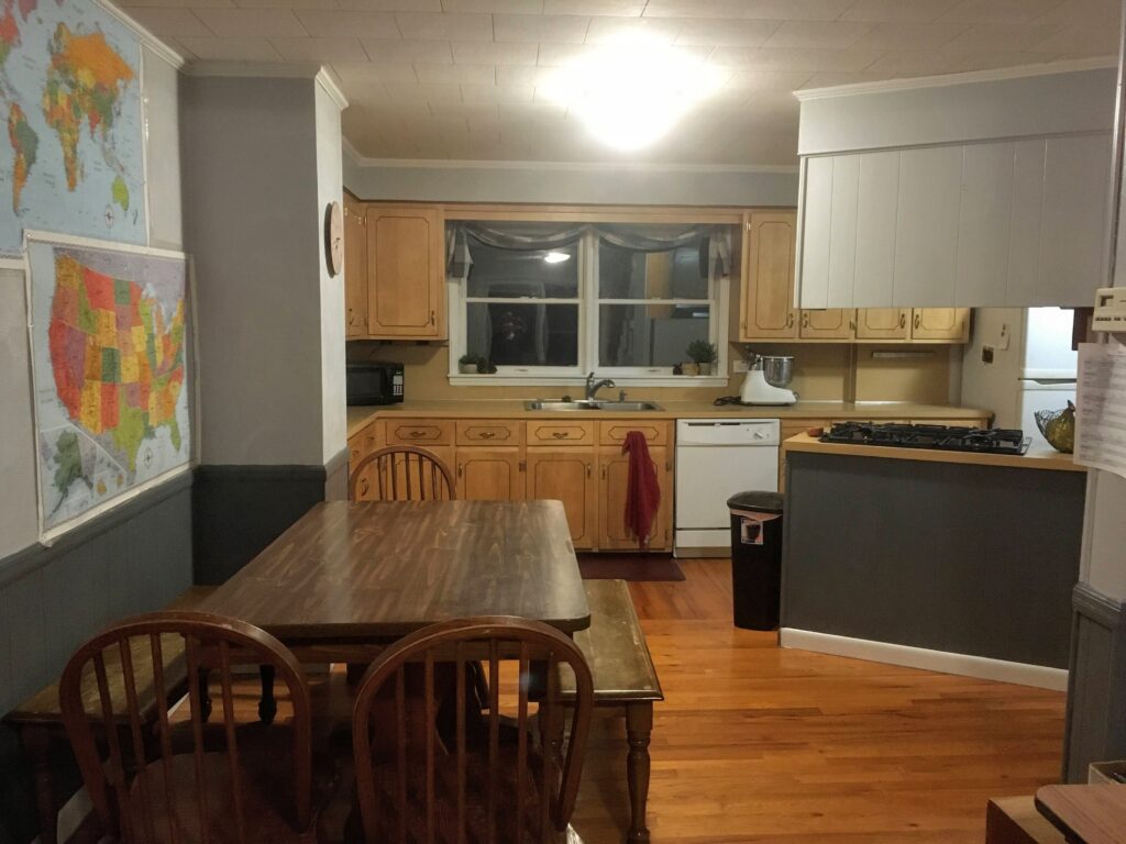 70's kitchen and dining room updated with the wood paneling and walls painted light and dark gray