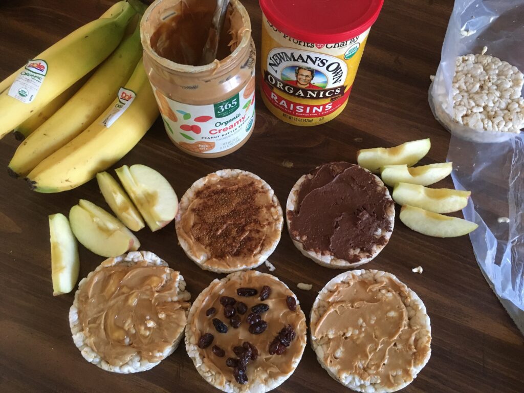 rice cakes with toppings bananas, peanut butter, raisins