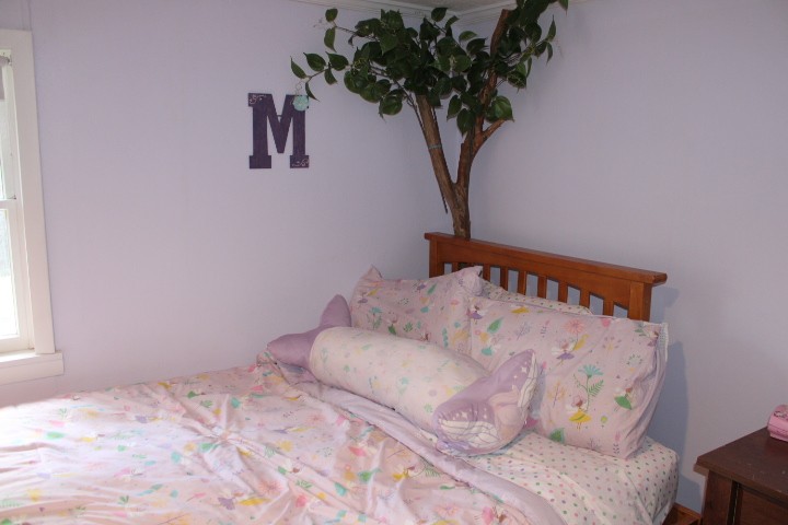 lavender girls bedroom with real tree and fake branches fair bedroom.