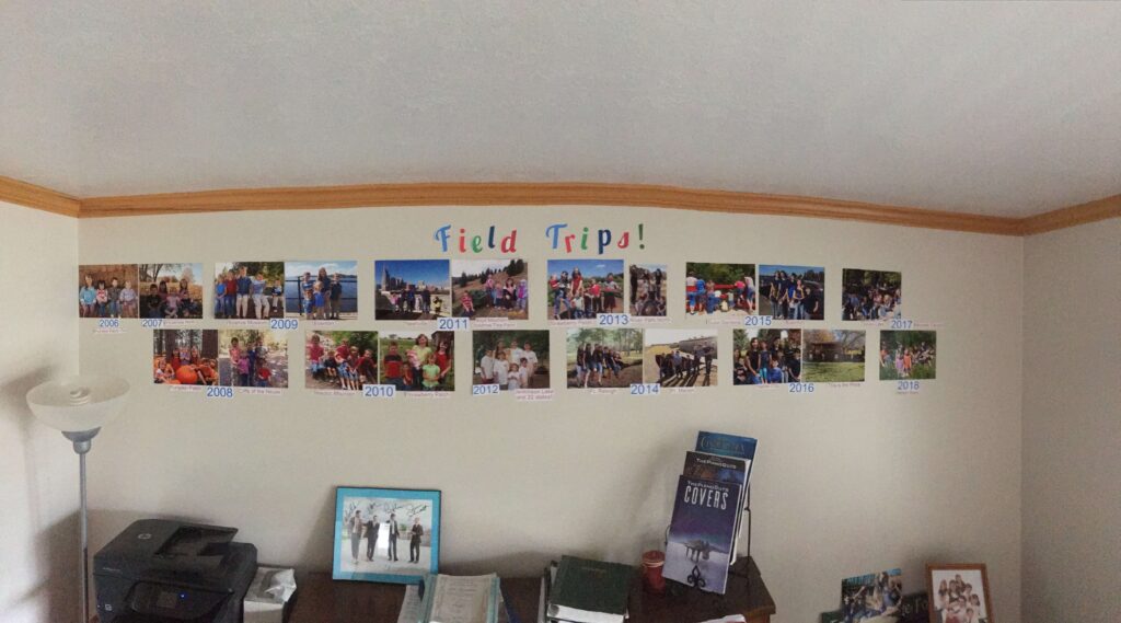 A wall filled with pictures from field trips.