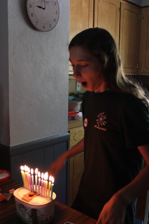13 year old blows out candles