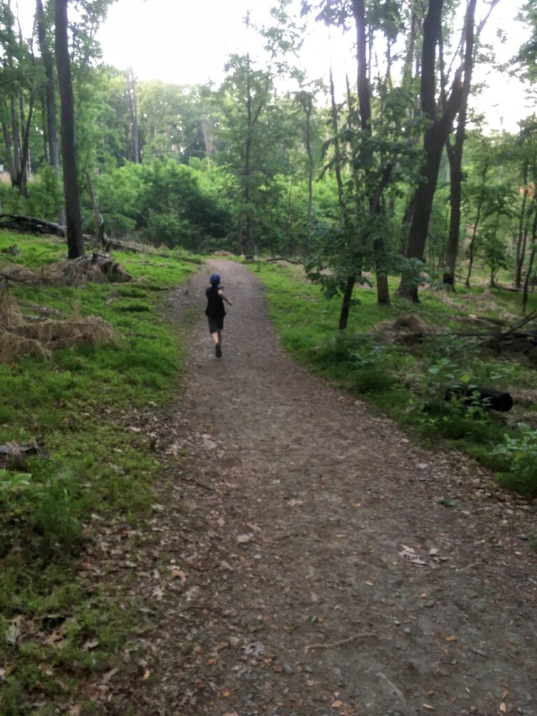 Samuel running down the Grindstone Trail at Pilot Mountain State Park