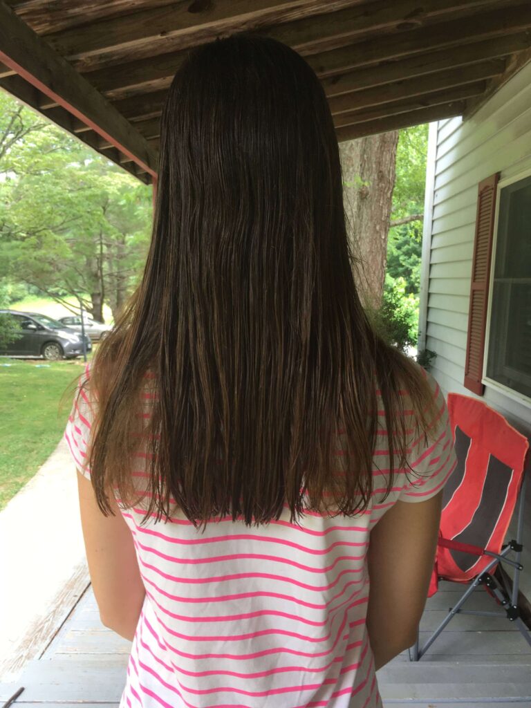 13 year old girl with hair down her back, just getting it trimmed