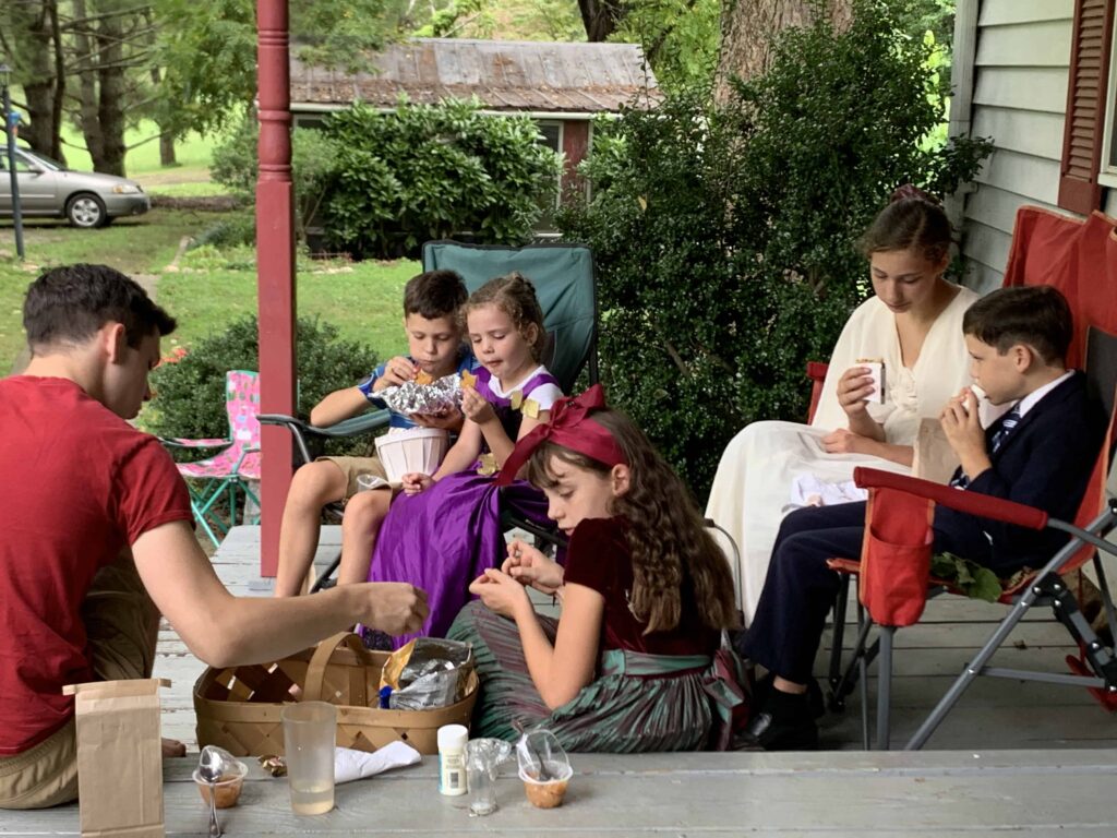 kids eating lunch on the porch