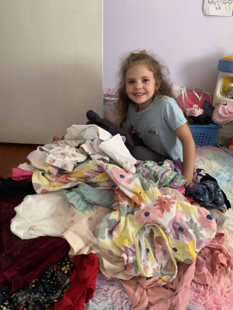 6 year old cleaning out her closet