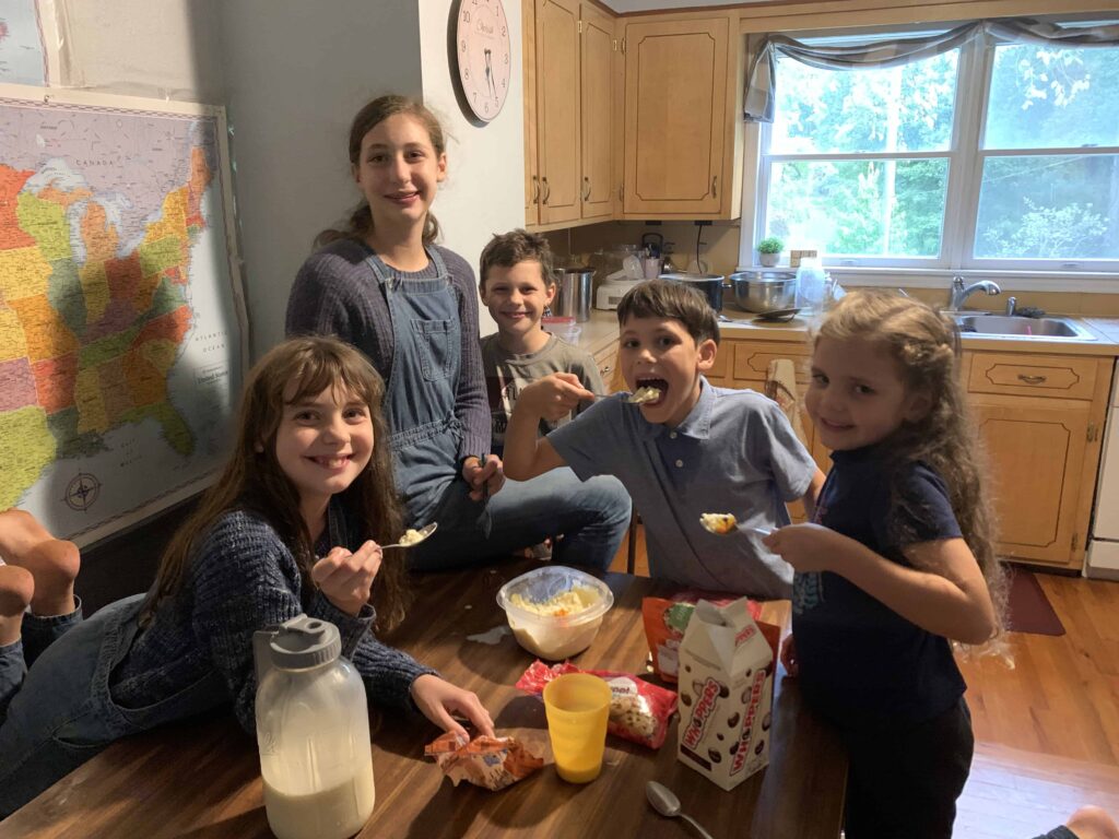 5 kids eating homemade ice cream in the kitchen