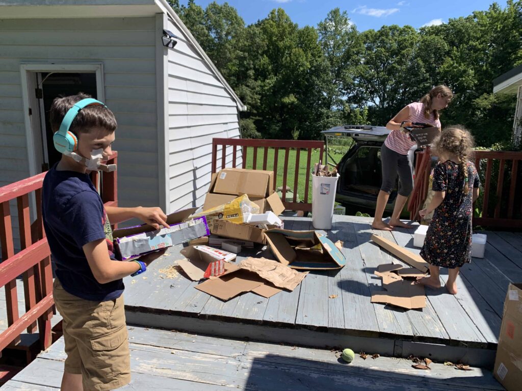 kids cleaning out a shed