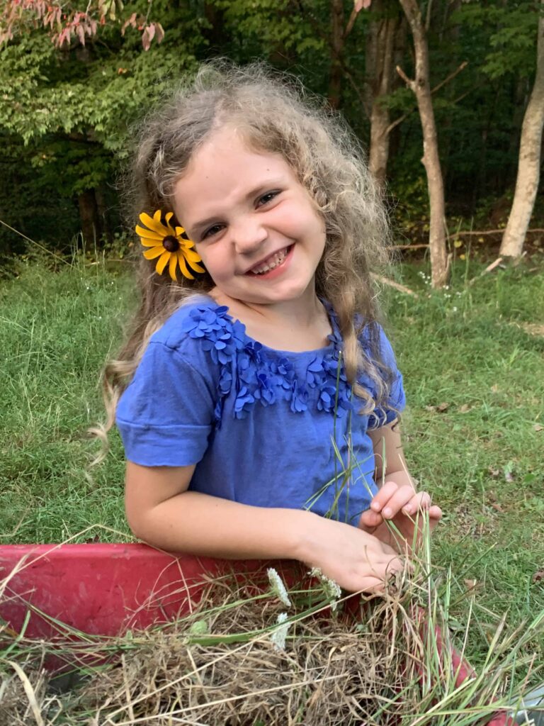 6 year old girl with a flower in her hair